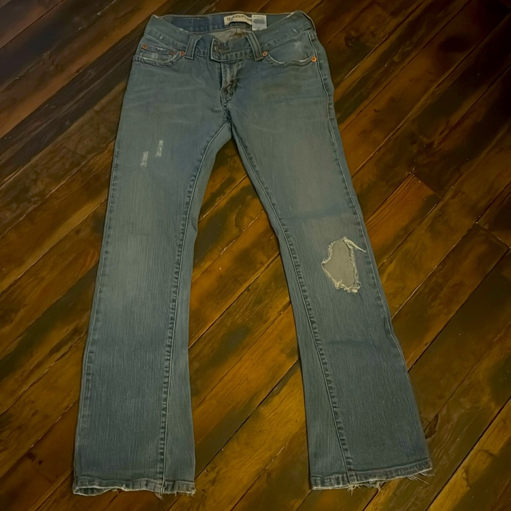 Levi jeans.  Very loved.  Size 5 slouch flare